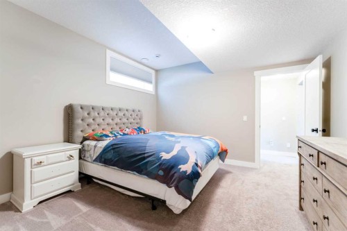 102 Coopersfield Way Sw, Airdrie, AB - Indoor Photo Showing Bedroom