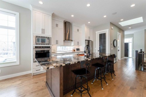 102 Coopersfield Way Sw, Airdrie, AB - Indoor Photo Showing Kitchen With Upgraded Kitchen