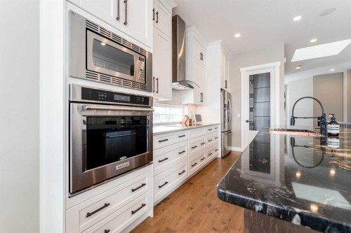 102 Coopersfield Way Sw, Airdrie, AB - Indoor Photo Showing Kitchen With Upgraded Kitchen