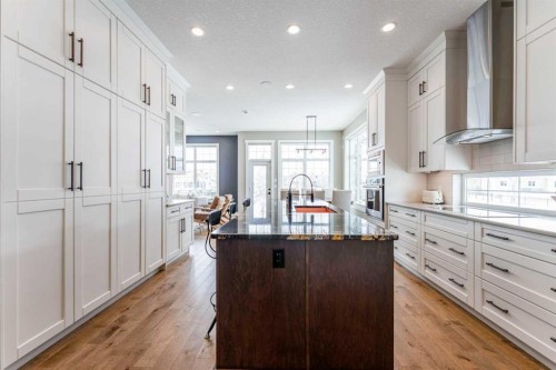 102 Coopersfield Way Sw, Airdrie, AB - Indoor Photo Showing Kitchen With Upgraded Kitchen