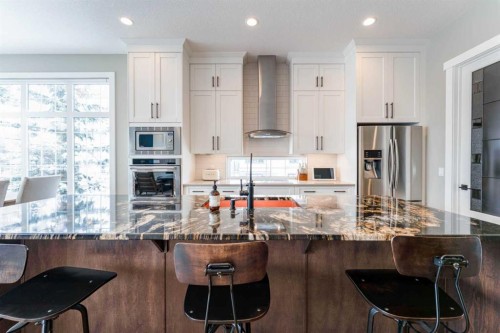 102 Coopersfield Way Sw, Airdrie, AB - Indoor Photo Showing Kitchen With Upgraded Kitchen
