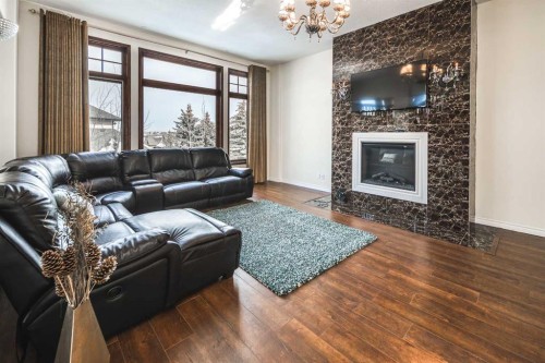 5 Elveden Point Sw, Calgary, AB - Indoor Photo Showing Living Room With Fireplace