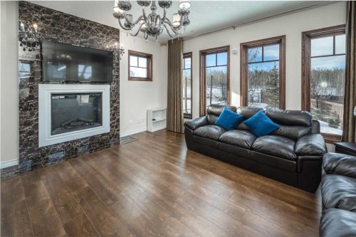 5 Elveden Point Sw, Calgary, AB - Indoor Photo Showing Living Room With Fireplace