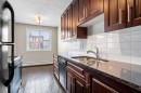 301-4455A Greenview Drive Ne, Calgary, AB  - Indoor Photo Showing Kitchen With Double Sink With Upgraded Kitchen 