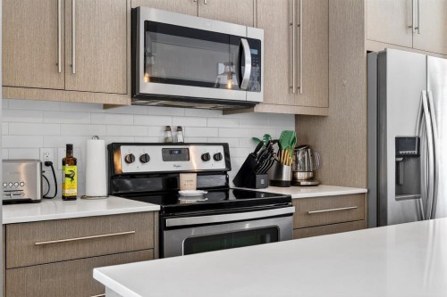 43-111 Rainbow Falls, Chestermere, AB - Indoor Photo Showing Kitchen With Stainless Steel Kitchen With Upgraded Kitchen