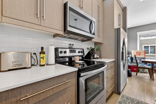 43-111 Rainbow Falls, Chestermere, AB - Indoor Photo Showing Kitchen With Stainless Steel Kitchen With Upgraded Kitchen
