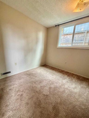 92 Queen Isabella Close Se, Calgary, AB - Indoor Photo Showing Other Room