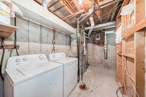 92 Queen Isabella Close Se, Calgary, AB - Indoor Photo Showing Laundry Room