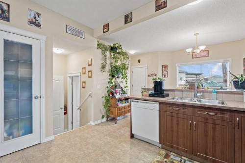 40 Cimarron Grove Drive, Okotoks, AB - Indoor Photo Showing Kitchen With Double Sink