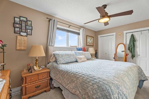40 Cimarron Grove Drive, Okotoks, AB - Indoor Photo Showing Bedroom