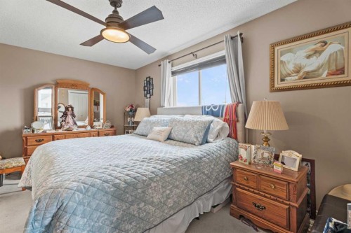 40 Cimarron Grove Drive, Okotoks, AB - Indoor Photo Showing Bedroom
