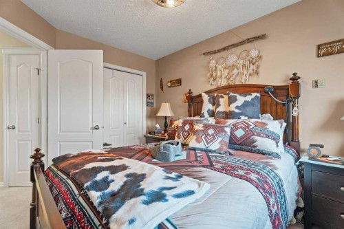 40 Cimarron Grove Drive, Okotoks, AB - Indoor Photo Showing Bedroom
