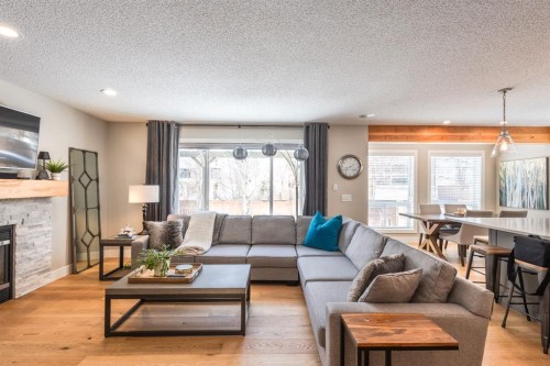 77 Weston Way Sw, Calgary, AB - Indoor Photo Showing Living Room With Fireplace