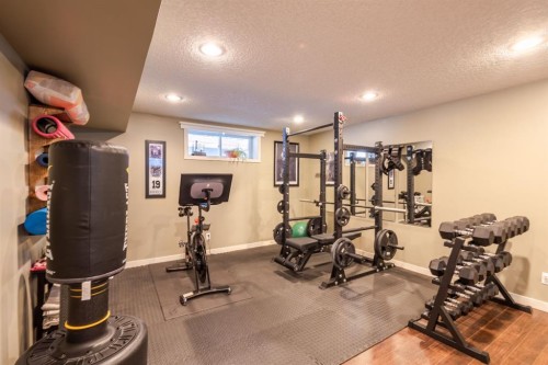 77 Weston Way Sw, Calgary, AB - Indoor Photo Showing Gym Room