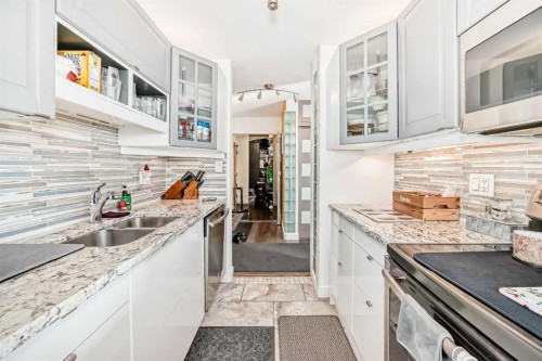 #912-8604 48 Avenue Nw, Calgary, AB - Indoor Photo Showing Kitchen With Double Sink With Upgraded Kitchen