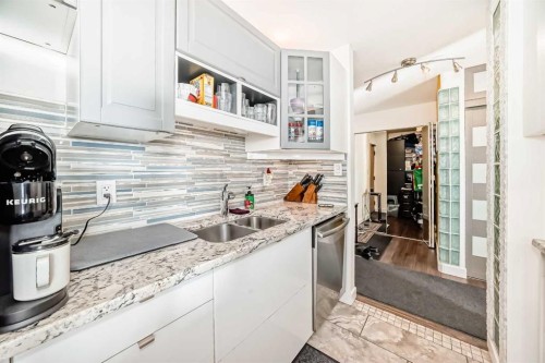 #912-8604 48 Avenue Nw, Calgary, AB - Indoor Photo Showing Kitchen With Stainless Steel Kitchen With Double Sink With Upgraded Kitchen