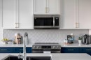 87 Waterford Mews, Chestermere, AB  - Indoor Photo Showing Kitchen With Upgraded Kitchen 
