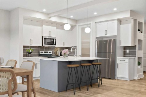 59 Waterford Mews, Chestermere, AB - Indoor Photo Showing Kitchen With Upgraded Kitchen