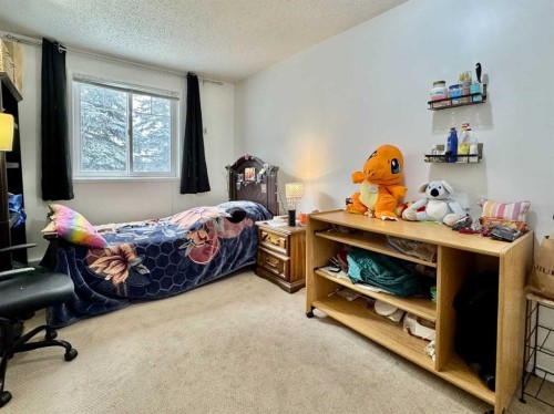 208C-5601 Dalton Drive Nw, Calgary, AB - Indoor Photo Showing Bedroom