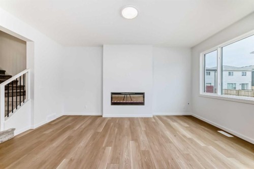 58 Walgrove Bay Se, Calgary, AB - Indoor Photo Showing Other Room With Fireplace