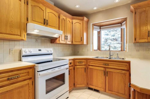 55 Oakmount Court Sw, Calgary, AB - Indoor Photo Showing Kitchen With Double Sink