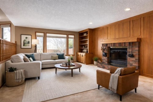 55 Oakmount Court Sw, Calgary, AB - Indoor Photo Showing Living Room With Fireplace