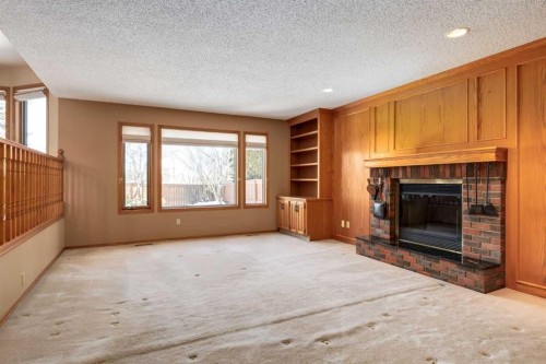 55 Oakmount Court Sw, Calgary, AB - Indoor Photo Showing Living Room With Fireplace