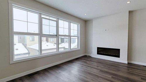 282 Alpine Avenue Sw, Calgary, AB - Indoor Photo Showing Other Room With Fireplace