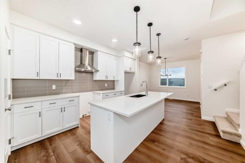 62 Starling Boulevard Nw, Calgary, AB - Indoor Photo Showing Kitchen With Upgraded Kitchen