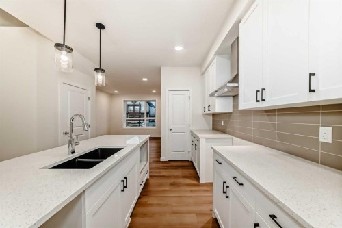 62 Starling Boulevard Nw, Calgary, AB - Indoor Photo Showing Kitchen With Double Sink With Upgraded Kitchen