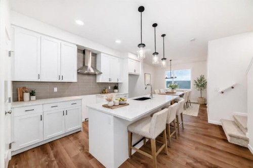 62 Starling Boulevard Nw, Calgary, AB - Indoor Photo Showing Kitchen With Upgraded Kitchen