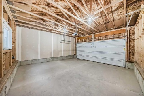 62 Starling Boulevard Nw, Calgary, AB - Indoor Photo Showing Garage