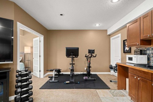 102 Morningside Point Sw, Airdrie, AB - Indoor Photo Showing Gym Room