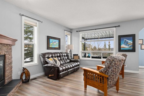102 Morningside Point Sw, Airdrie, AB - Indoor Photo Showing Living Room With Fireplace