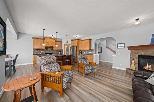102 Morningside Point Sw, Airdrie, AB - Indoor Photo Showing Living Room With Fireplace
