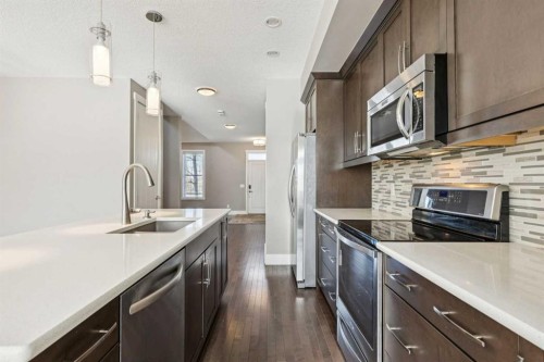 442 Quarry Park Boulevard Se, Calgary, AB - Indoor Photo Showing Kitchen With Upgraded Kitchen