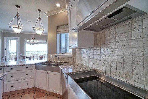 8 Mt Douglas Point Se, Calgary, AB - Indoor Photo Showing Kitchen With Double Sink