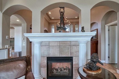 8 Mt Douglas Point Se, Calgary, AB - Indoor Photo Showing Living Room With Fireplace