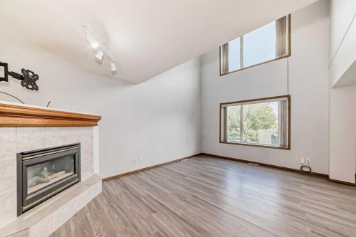 172 Panorama Hills Place Nw, Calgary, AB - Indoor Photo Showing Living Room With Fireplace