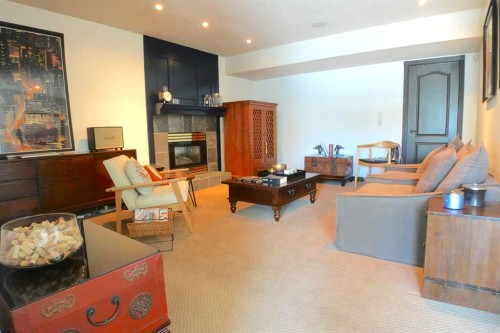 16021 Mckenzie Lake Way Se, Calgary, AB - Indoor Photo Showing Living Room With Fireplace