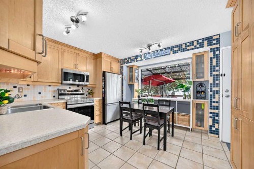 3321 56 Street Ne, Calgary, AB - Indoor Photo Showing Kitchen With Stainless Steel Kitchen With Double Sink