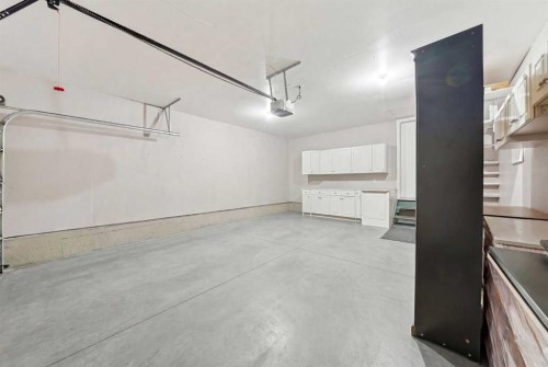 59 Sunlake Close Se, Calgary, AB - Indoor Photo Showing Garage