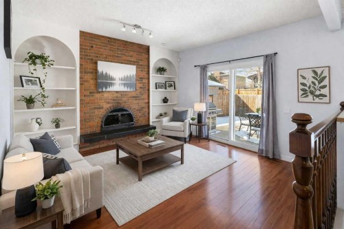 14520 Parkside Drive Se, Calgary, AB - Indoor Photo Showing Living Room With Fireplace