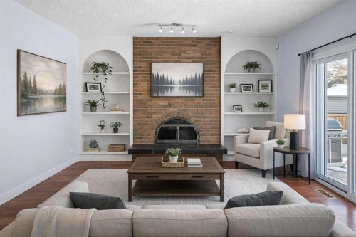 14520 Parkside Drive Se, Calgary, AB - Indoor Photo Showing Living Room With Fireplace