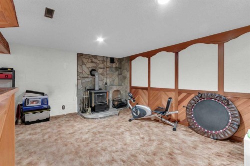 6004 Maddock Drive Ne, Calgary, AB - Indoor With Fireplace