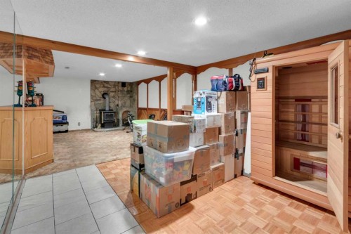 6004 Maddock Drive Ne, Calgary, AB - Indoor Photo Showing Other Room With Fireplace