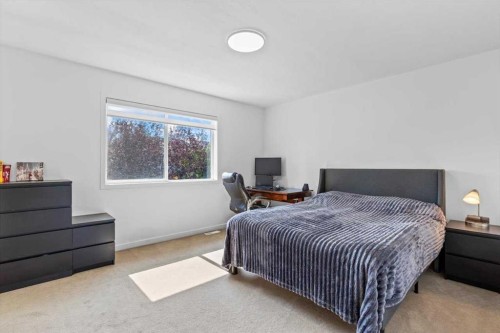 57 Everwillow Boulevard Sw, Calgary, AB - Indoor Photo Showing Bedroom