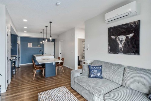 1306-42 Cranbrook Gardens Se, Calgary, AB - Indoor Photo Showing Living Room