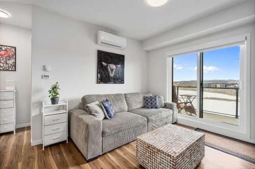 1306-42 Cranbrook Gardens Se, Calgary, AB - Indoor Photo Showing Living Room