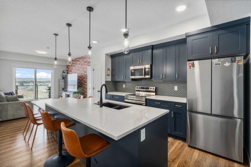 1306-42 Cranbrook Gardens Se, Calgary, AB - Indoor Photo Showing Kitchen With Stainless Steel Kitchen With Double Sink With Upgraded Kitchen